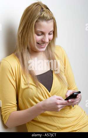 Young woman texting Stock Photo