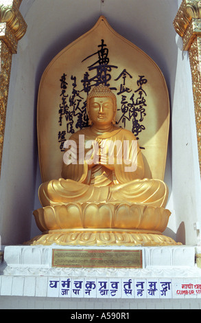 Buddha turning the wheel of the Dhamma as the first sermon at World Peace Pagoda Pokhara city Nepal Stock Photo