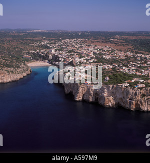 Aerial view over coast at Cala En Porter and famous cave disco Menorca Baleares Spain Stock Photo