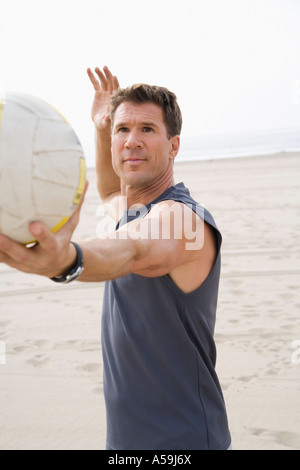 Man Playing Volleyball Stock Photo