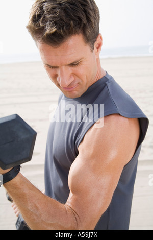 Man Exercising on Beach Stock Photo