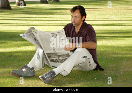 3120 Model released  Man reading newspaper Stock Photo