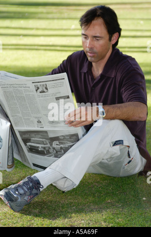 3120 Model released  Man reading newspaper Stock Photo
