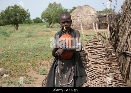 Arbore tribe child holding a gourd hat, Lower Omo Valley, Ethiopia Stock Photo