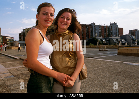 Two women posing on a pavement in Kosovo Serbia and Montenegro Stock Photo