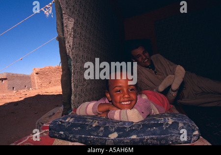 A Sahrawi girl lying down in her tent in Tindouf Western Algeria Stock Photo