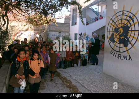 Schoolchildren line up at UNRWA s Yarmouk Palestinian refugee camp in Syria Stock Photo