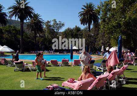 Tourists relax around a swimming pool. Cape Town South Africa RSA Stock Photo