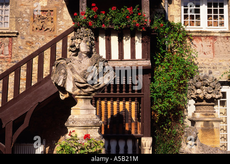 France, Normandy, Dives sur Mer, Calvados, Cote Fleurie Colombage. Exterior of old stone and half timbered house. Bust of Louis XIV in courtyard Stock Photo