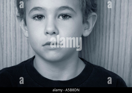 Sad face of a young boy. Stock Photo