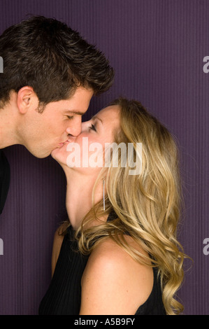 Young woman and man couple, in love kissing. Stock Photo