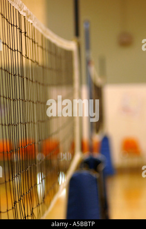 Volleyball net in gymnasium. Stock Photo