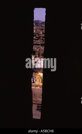 Old city as seen through arrow loop of Al Hakim mosque nicknamed al-Anwar named after Al-Hakim bi-Amr Allah (985–1021), the sixth Fatimid caliph and 1 Stock Photo