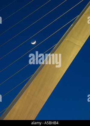 The moon shines behind the dramatic tower of the Sundial Bridge at Turtle Bay in Redding California designed by Santiago Calat Stock Photo