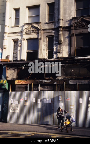 Burnt out shops in run down area of Peckham SE15 London England UK Stock Photo