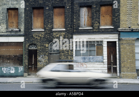 Empty Victorian terraced homes boarded up in a south London street SE1 England UK ready for redevelopment Stock Photo