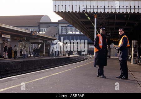 Two guards at one of the busiest station in London the Clampham Junction UK Stock Photo