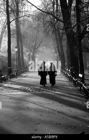 Nuns walking in Krakow Poland black and white Stock Photo