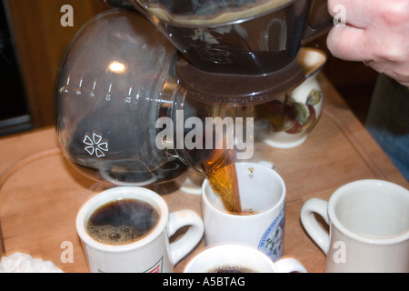 Pouring freshly brewed coffee at dinner party. St Paul Minnesota USA Stock Photo