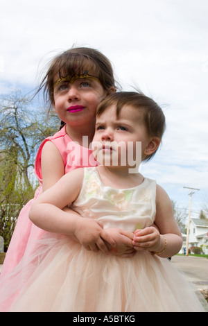 Sisters in their Easter dresses age one and three. St Paul Minnesota USA Stock Photo