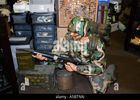 Mannequin soldier dressed in camouflage uniform holding rifle. Minneapolis Minnesota USA Stock Photo