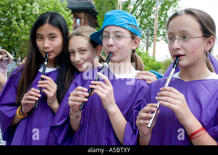 Multiracial group of teens playing recorders. In the Heart of the Beast May Day Festival and Parade Minneapolis Minnesota USA Stock Photo