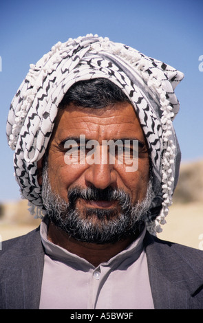 Man from eastern Iran wearing traditional head gear in Persepolis Stock Photo