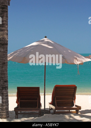 Resort umbrella two sun loungers white sand Bo Phut Beach Ko Samui island Thailand Stock Photo
