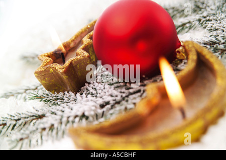 Christmas candles and baubles, close-up Stock Photo