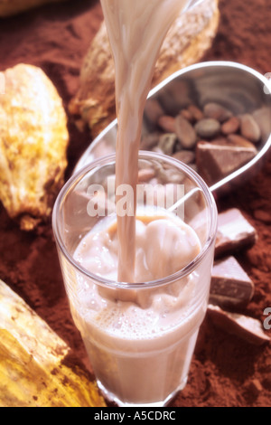 Chocolate drink pouring into glass Stock Photo