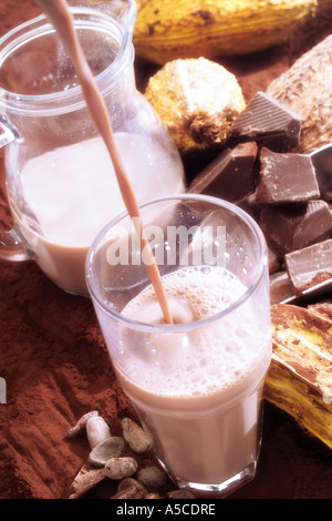 Chocolate drink pouring into glass Stock Photo