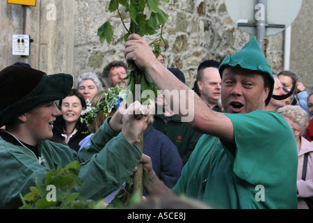 Robin Hood and Little John fight during Helston's celebration of May day Stock Photo