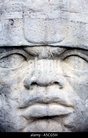 maya stone face carved in rock Stock Photo