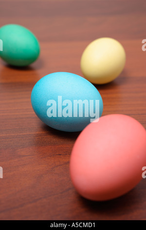 Easter Eggs in a Row on a wooden table Stock Photo