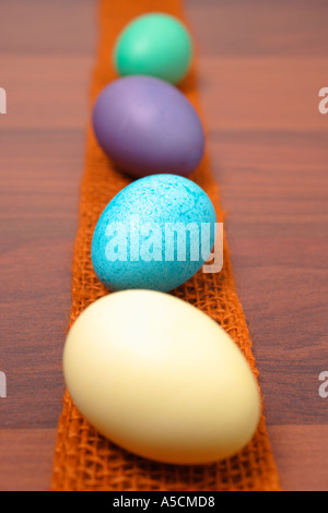 Easter Eggs in a Row on a wooden table Stock Photo