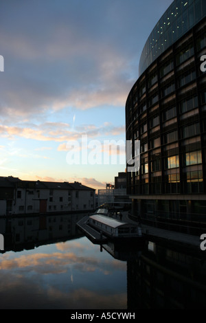 Silhouettes and reflections of The Point and buildings in London's Paddington Basin Stock Photo