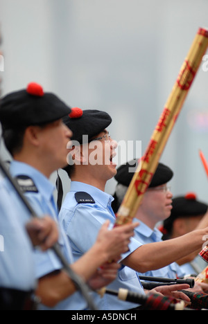 Chinese policeman wearing the traditional Scottish Balmoral hat marching taking part in the Hong Kong Chinese New Year Parade in China Stock Photo