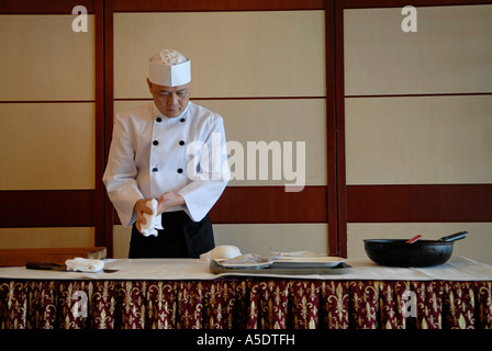 Chef at work in a restaurant Hong Kong China Stock Photo