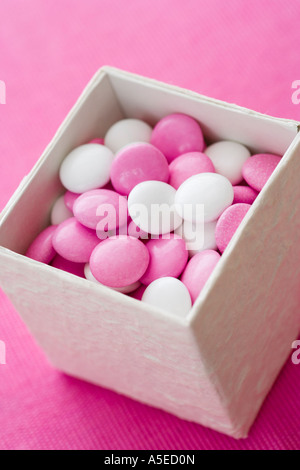 Pink peppermint candies in white box Stock Photo - Alamy