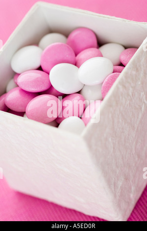 Pink peppermint candies in white box Stock Photo - Alamy