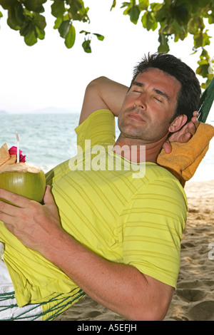 Man relax in Hammock at yao yai island resort Stock Photo