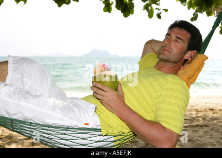 Man relax in Hammock at yao yai island resort Stock Photo