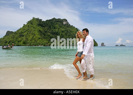 couple in love enjoy holiday on tropical beach in Thailand Stock Photo