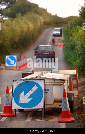 A MOBILE GENERATOR BEING USED TO POWER TEMPORARY TRAFFIC LIGHTS AT A ROAD WORKS UK Stock Photo