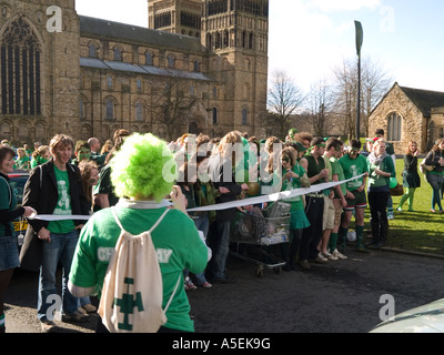 Students from St Chads college Durham at the start of a race around the green outside the cathedral Stock Photo