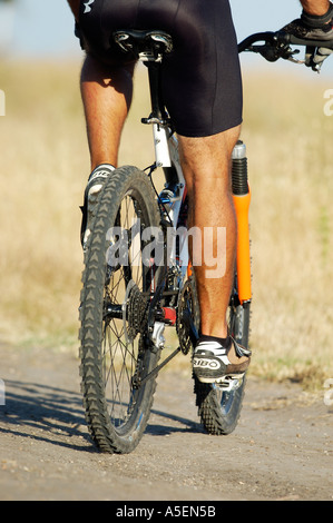man on bike buttocks and legs on mountain bike Stock Photo