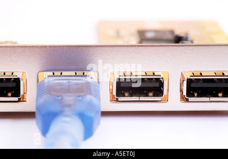 Computer USB cable connecting to port Stock Photo