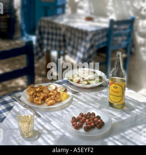 Greek food and wine in a traditional taverna in the village of Zia, Kos, Dodecanese Islands, Greece Stock Photo