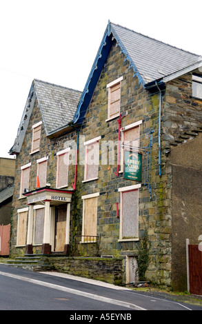 Closed Abbey Arms Hotel pub at Llan Ffestiniog Gwynedd North Wales UK boarded up and derelict Stock Photo