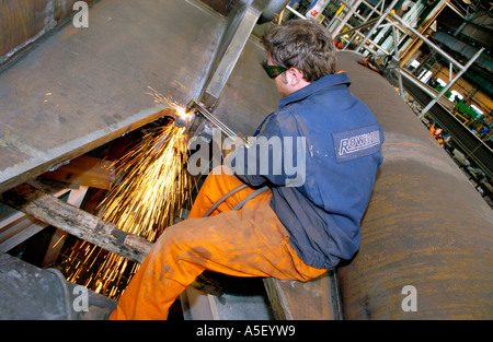 Engineers fabricate part of a steel foot and cycle bridge to cross the River Usk at Newport Gwent South Wales UK Stock Photo